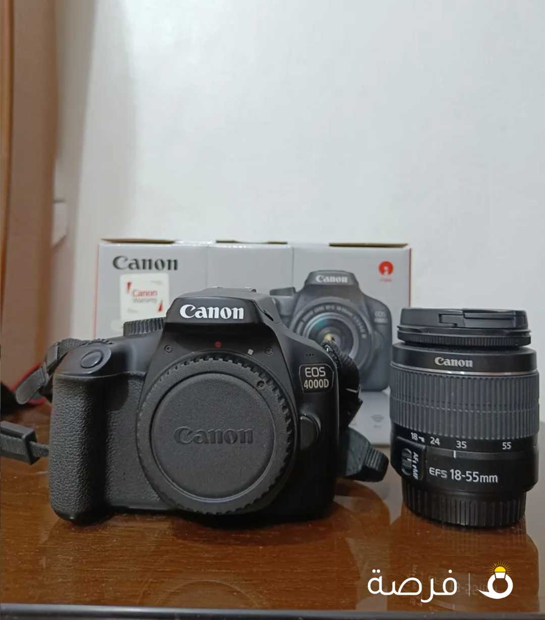 Canon 4000D camera with 18-55 lens and free accessories.