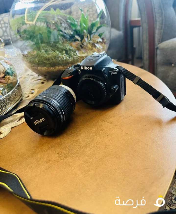 Nikon D5600 with kit lenses, battery and charger and box, never used