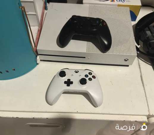 Xbox 1s with two controllers