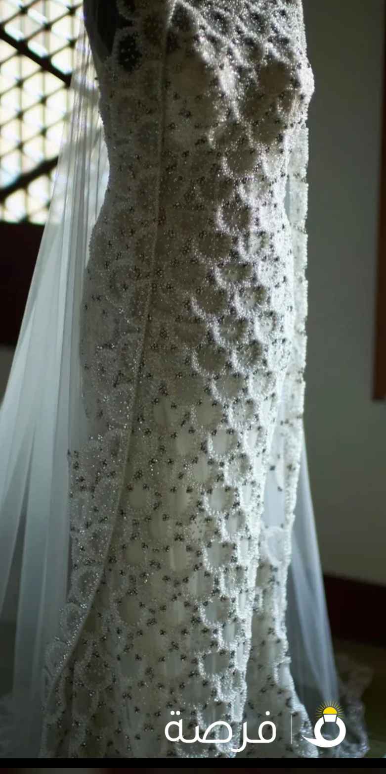 فستان عروس جميل جدا مطرز بخرز من براند عالمي