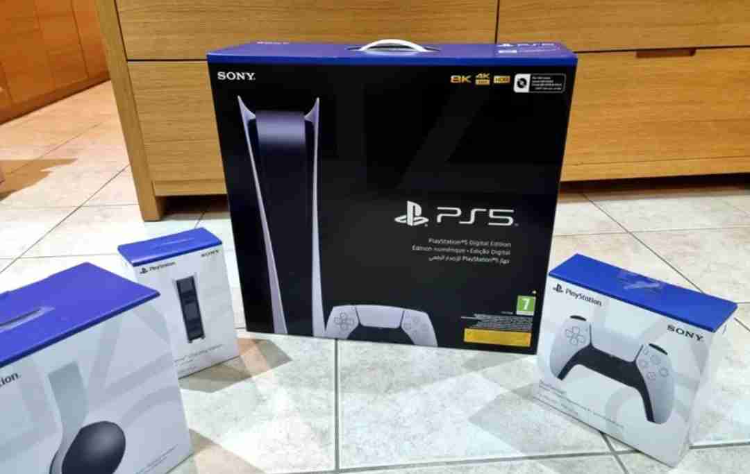 ps5 digital with extra controller, 3d headset, and charging station.