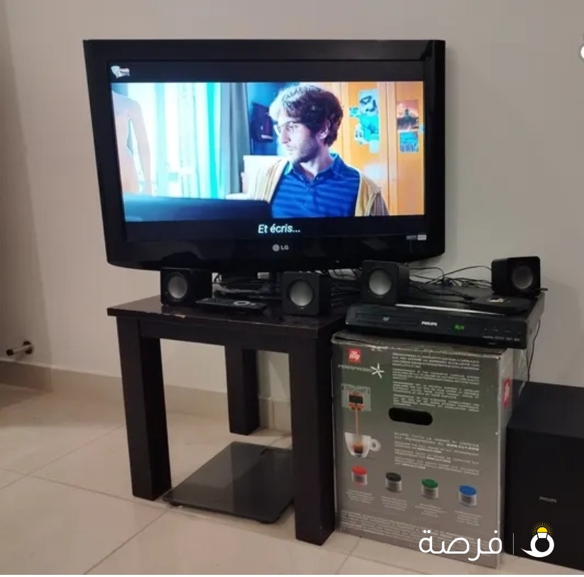 شاشة LG + هوم سينما philips + طاولة ايكيا